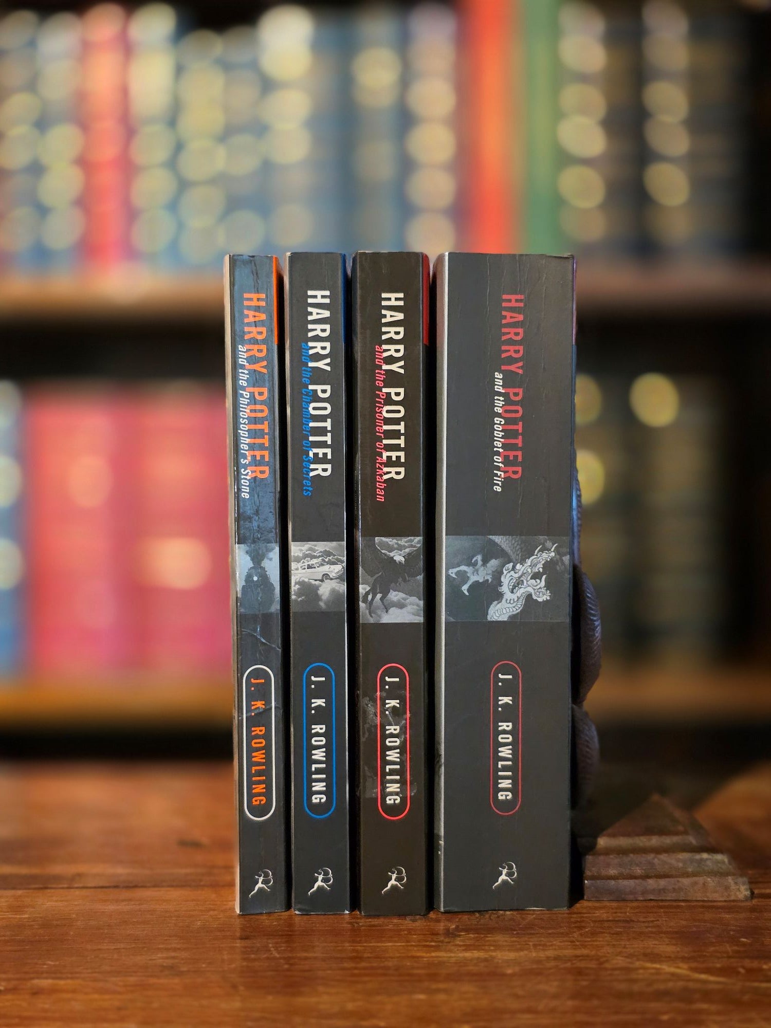 Complete set first adult editions of the Harry Potter series (1998-2001), consisting of Harry Potter and the Philosopher’s Stone, Chamber of Secrets, Prisoner of Azkaban and Goblet of Fire.